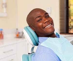 man smiling after the initial implant consultation