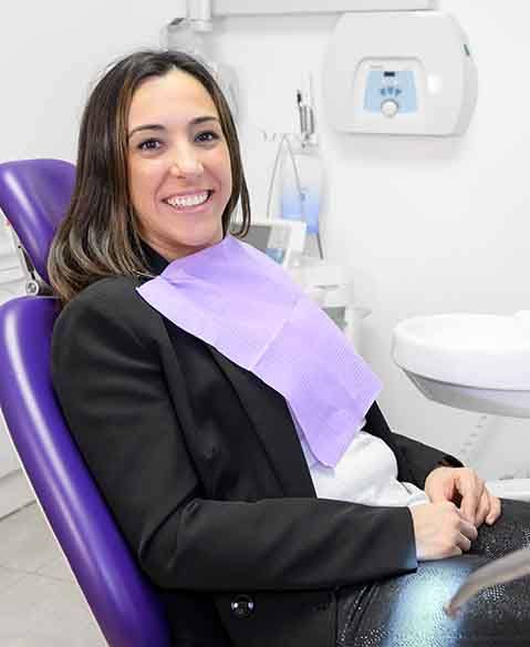 smiling patient sitting in the dentist’s chair