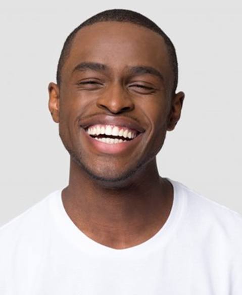 Man smiling after working with a cosmetic dentist in Fayetteville