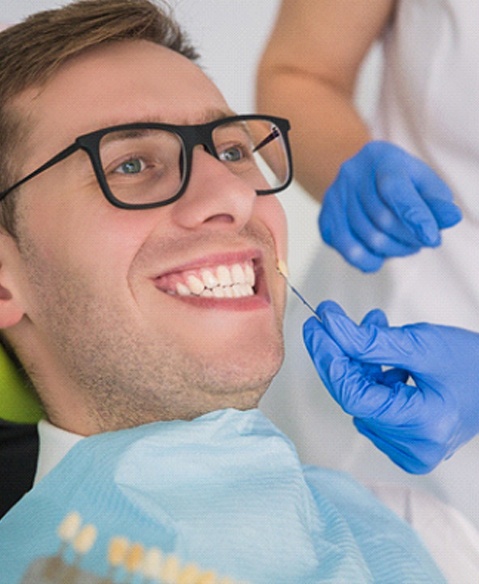 Man smiling with dental crowns in Fayetteville