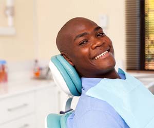 Man smiling and visiting an emergency dentist in Fayetteville