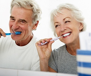 Couple brushing teeth in Fayetteville