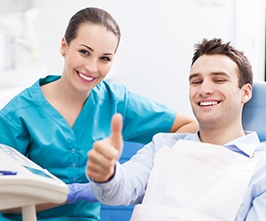 Man smiling after taking care of the preliminary procedures for dental implants in Fayetteville