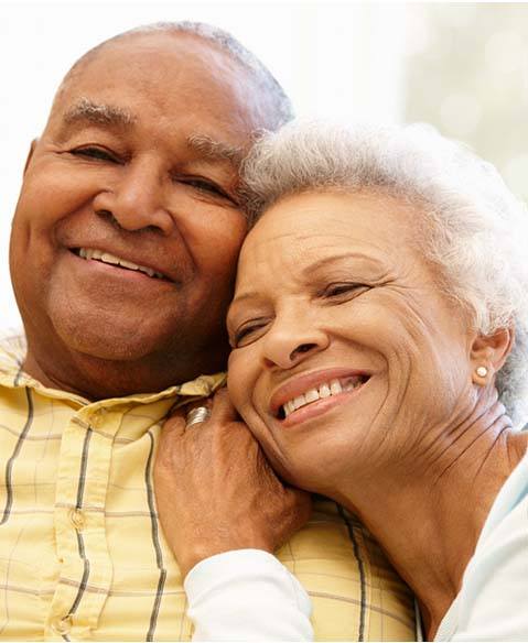 Happy couple enjoying the benefits of dental implants in Fayetteville