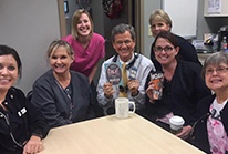 Group of Fayetteville dental team members sitting around a table