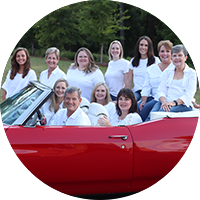 Fayetteville dental team members in a convertable