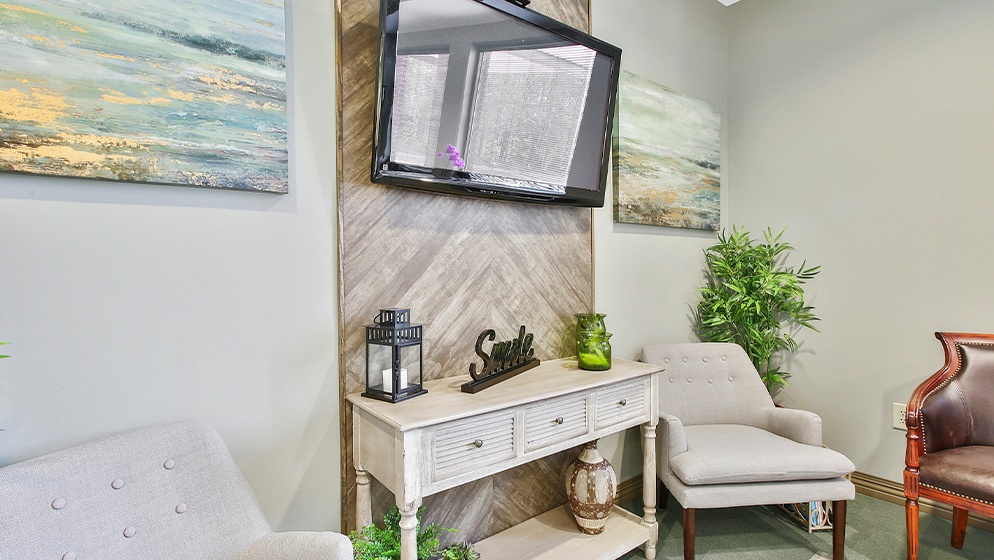 T V screen and seating in dental office waiting room