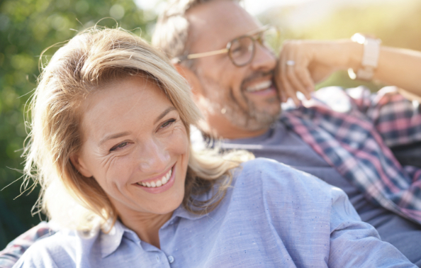 Man and woman with flawless smiles after cosmetic dentistry