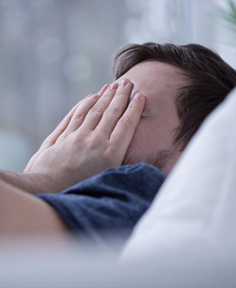 Frustrated man in need of sleep apnea therapy