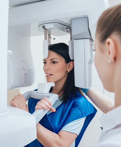 Woman receiving C T cone beam x ray scans