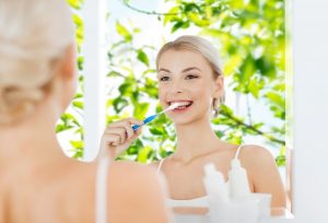 woman doing spring cleaning for her smile