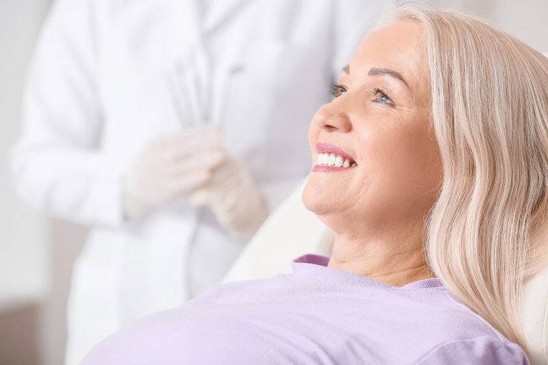 woman after receiving dental implants